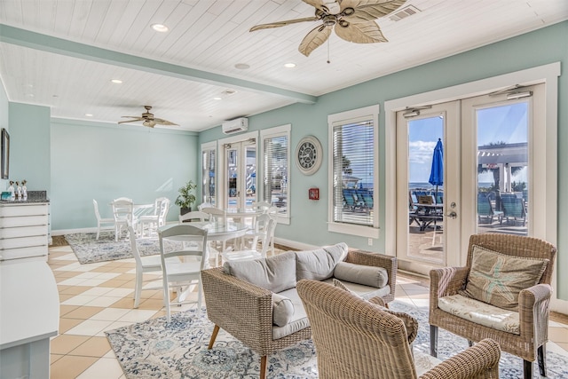 living room featuring beam ceiling, light tile patterned flooring, recessed lighting, french doors, and a wall mounted air conditioner