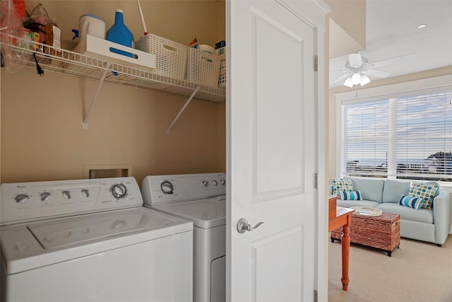 laundry area with laundry area, ceiling fan, carpet flooring, and washing machine and clothes dryer