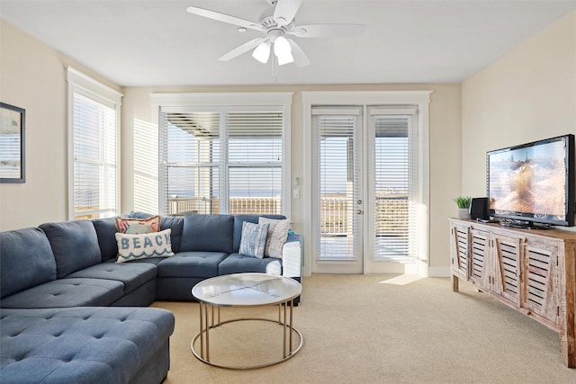 living room featuring a ceiling fan and carpet floors