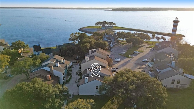 birds eye view of property with a water view and a residential view