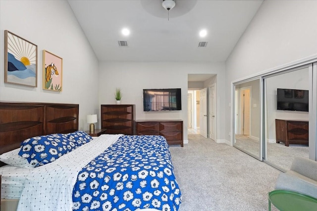 carpeted bedroom with a ceiling fan, vaulted ceiling, baseboards, and visible vents