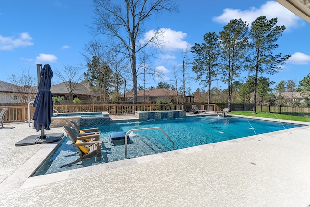 view of swimming pool with a patio, a fenced backyard, and a pool with connected hot tub