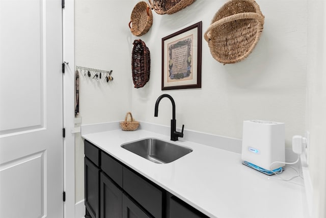 kitchen featuring light countertops and a sink