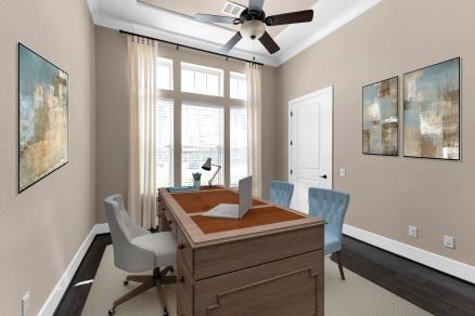 office space featuring a wealth of natural light, baseboards, and a ceiling fan