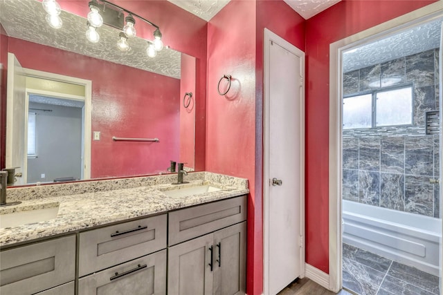 bathroom with double vanity and a sink