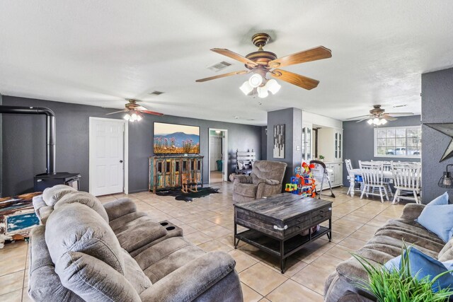 living room with light tile patterned floors and visible vents