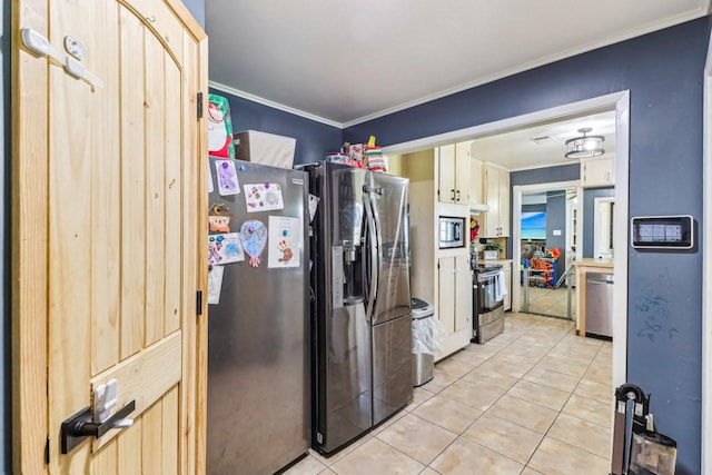 kitchen featuring light tile patterned floors, appliances with stainless steel finishes, and ornamental molding