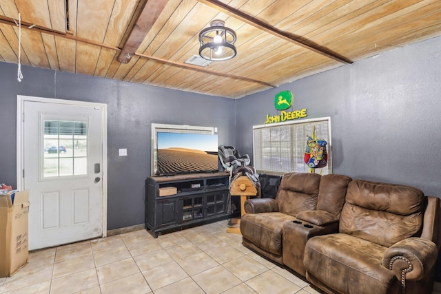 living area featuring light tile patterned floors, visible vents, and wood ceiling