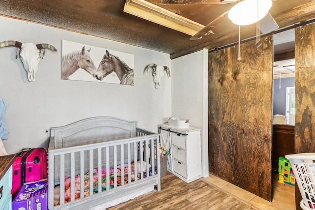 bedroom with wood finished floors