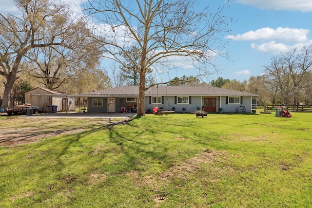 view of front of property featuring a patio, a front yard, and fence