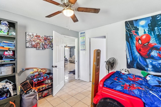 bedroom featuring tile patterned floors and ceiling fan