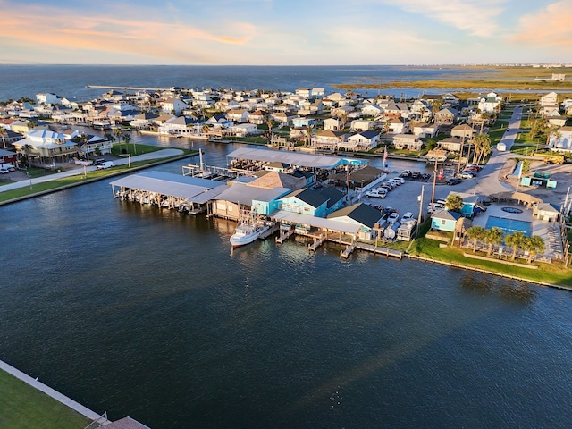 drone / aerial view with a water view and a residential view