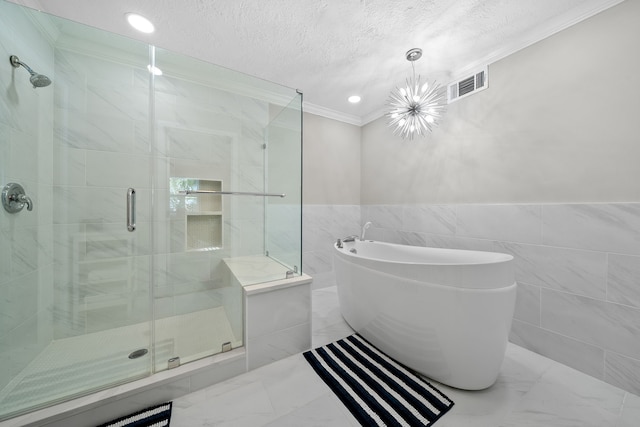 bathroom with visible vents, marble finish floor, a stall shower, ornamental molding, and a textured ceiling