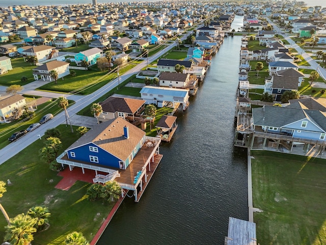 bird's eye view featuring a residential view and a water view