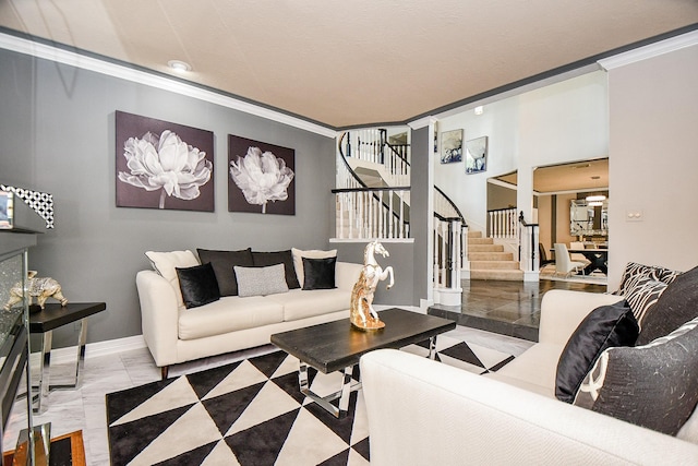 living room featuring stairs, baseboards, marble finish floor, and ornamental molding