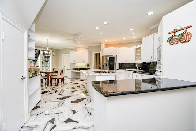 kitchen with built in microwave, ornamental molding, decorative backsplash, stainless steel refrigerator with ice dispenser, and marble finish floor