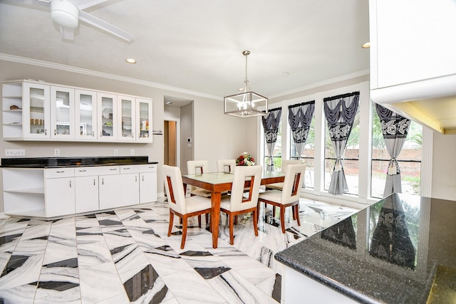 dining area with recessed lighting, marble finish floor, ornamental molding, and ceiling fan with notable chandelier