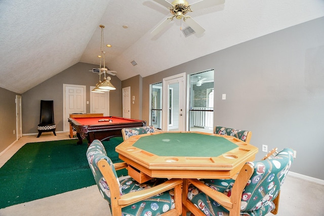 game room featuring baseboards, visible vents, lofted ceiling, a textured ceiling, and light colored carpet