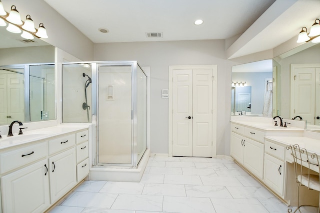 bathroom featuring visible vents, marble finish floor, a stall shower, and a sink