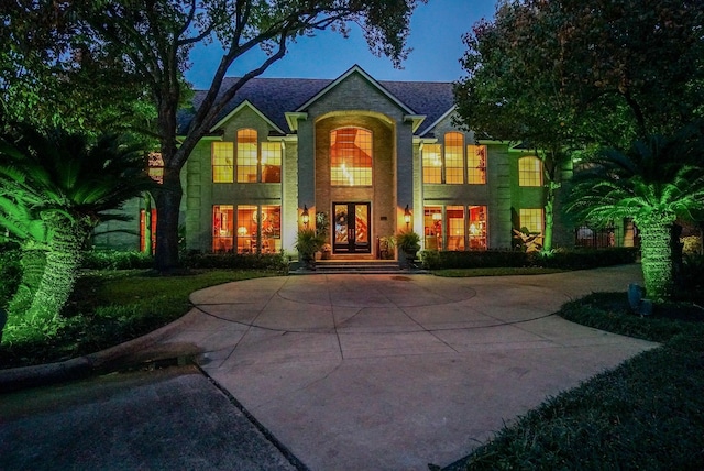 view of front of property with french doors and stone siding