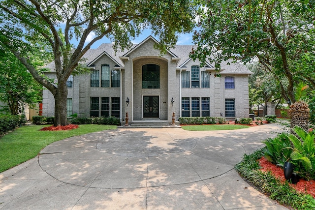 traditional-style house featuring french doors