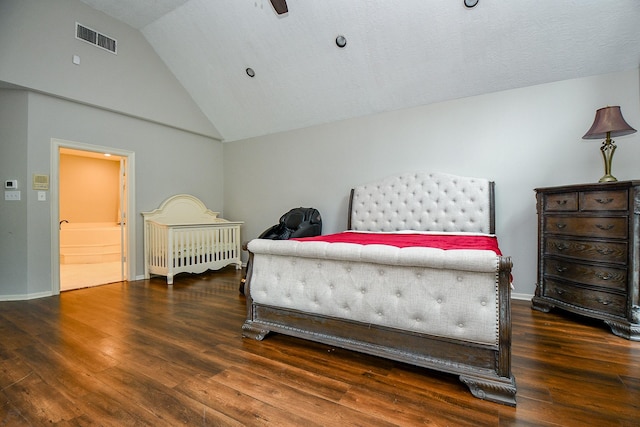 bedroom featuring visible vents, baseboards, lofted ceiling, and wood finished floors