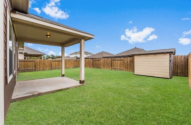 view of yard with a patio and a fenced backyard