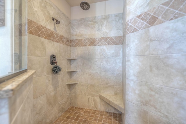 full bathroom with a tile shower