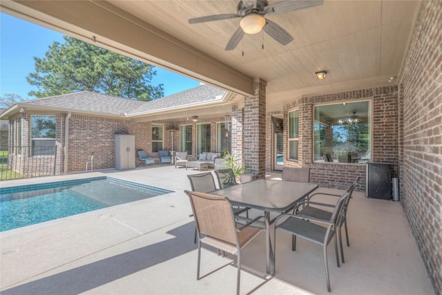 view of patio / terrace featuring an outdoor living space, an outdoor pool, outdoor dining area, and ceiling fan