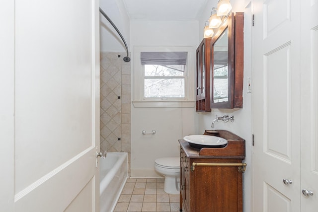 bathroom with tile patterned floors, toilet, vanity, and shower / tub combination