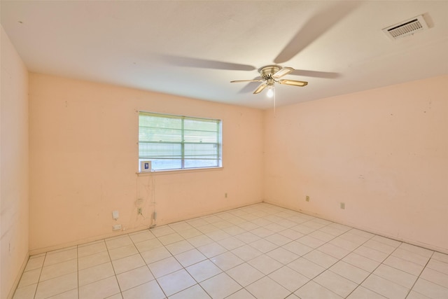 spare room with visible vents and a ceiling fan