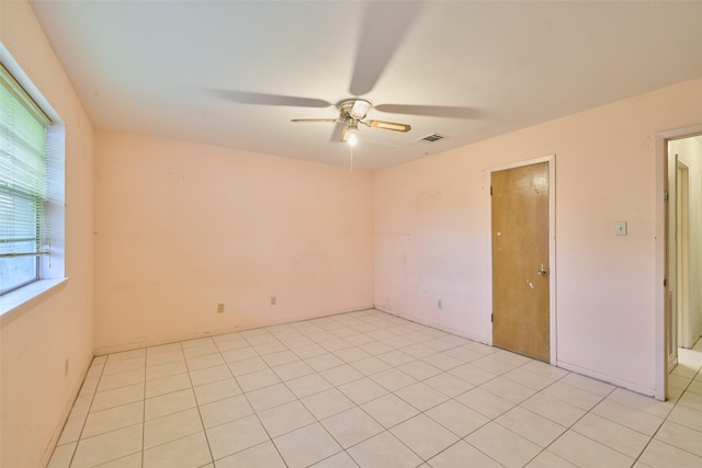 spare room featuring visible vents and ceiling fan