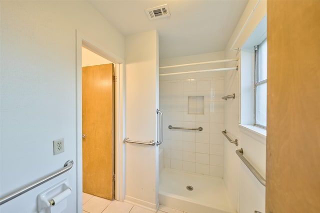 bathroom featuring visible vents, a stall shower, and tile patterned flooring