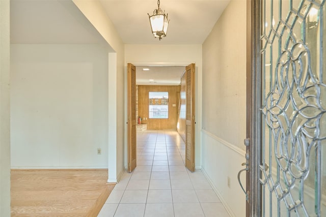 entryway featuring light tile patterned floors and baseboards