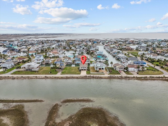 birds eye view of property featuring a residential view and a water view