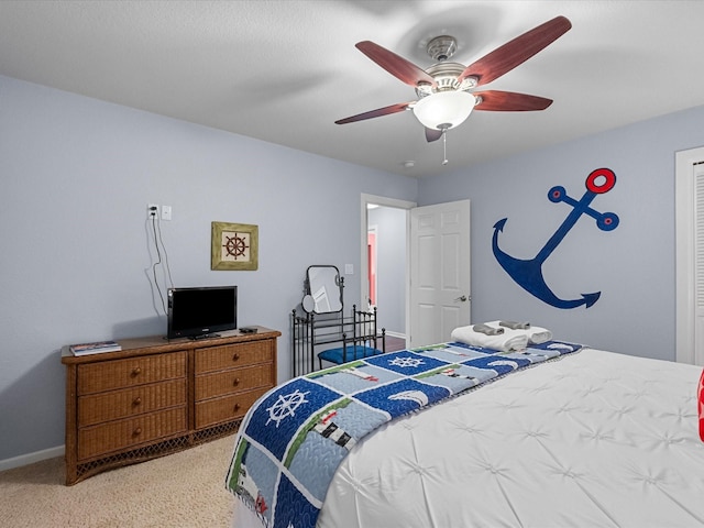 bedroom featuring ceiling fan and baseboards