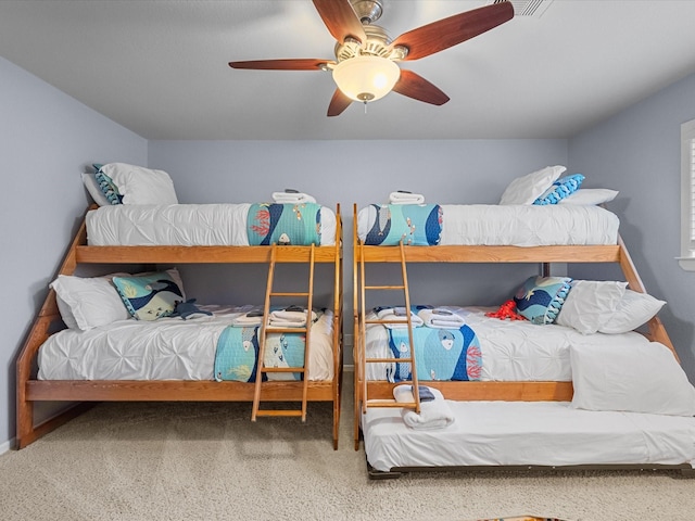 bedroom with a ceiling fan and carpet floors