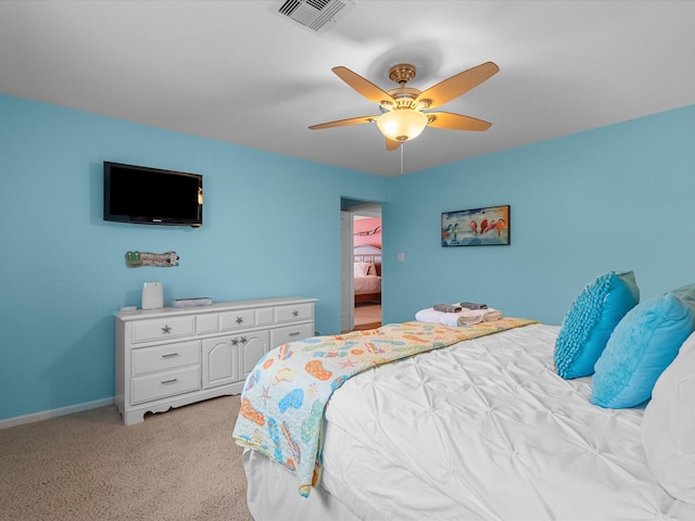 bedroom featuring visible vents, light carpet, baseboards, and ceiling fan