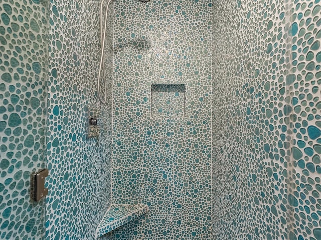 interior space featuring a tile shower