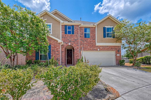 traditional-style home featuring brick siding, an attached garage, and concrete driveway