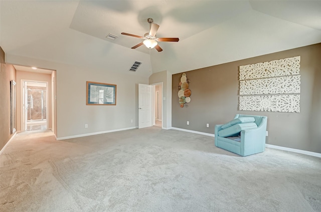 unfurnished room featuring visible vents, lofted ceiling, carpet, and baseboards