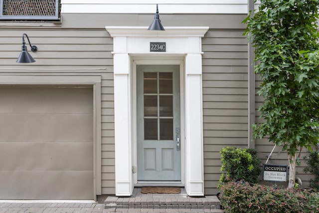 property entrance with a garage