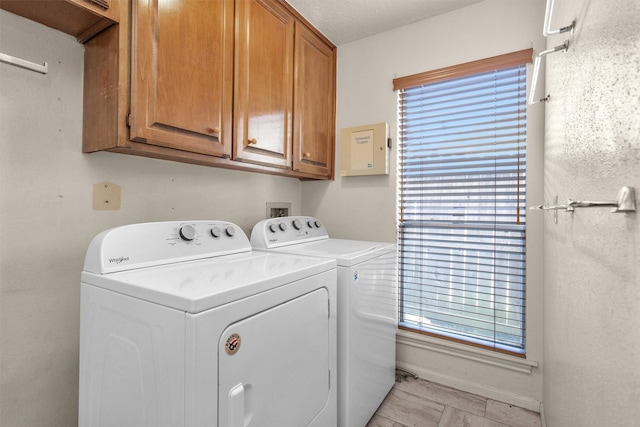 laundry area featuring cabinet space and washing machine and dryer