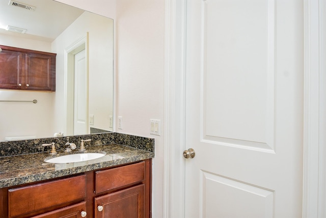 bathroom with visible vents and vanity