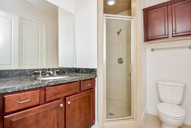 full bath with tile patterned flooring, baseboards, toilet, a stall shower, and vanity