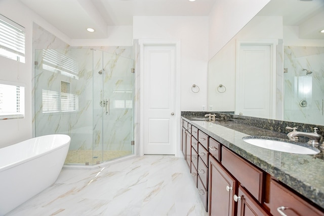 full bathroom featuring a freestanding tub, marble finish floor, a sink, a marble finish shower, and double vanity