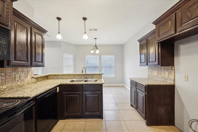 kitchen featuring visible vents, black appliances, a sink, a peninsula, and dark brown cabinets