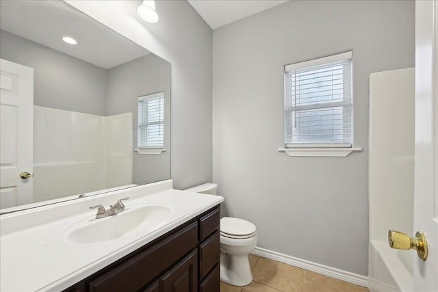 bathroom featuring tile patterned floors, baseboards, toilet, and walk in shower