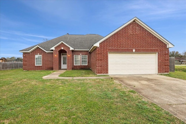 view of front of house with driveway, roof with shingles, a front lawn, a garage, and brick siding