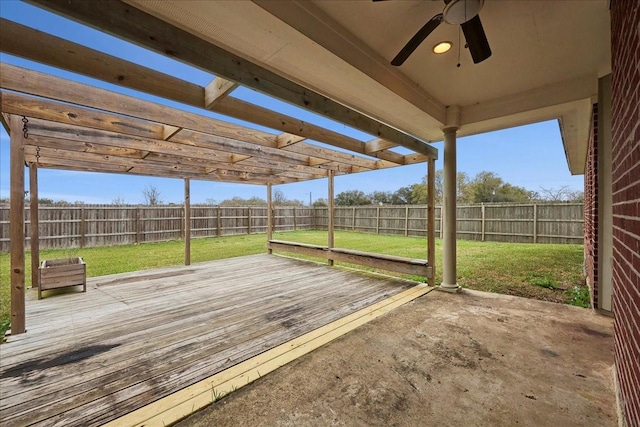 wooden terrace with a fenced backyard, a pergola, a yard, and a ceiling fan